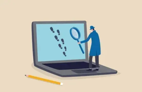 Detective with a magnifying glass examining digital footprints on a laptop screen