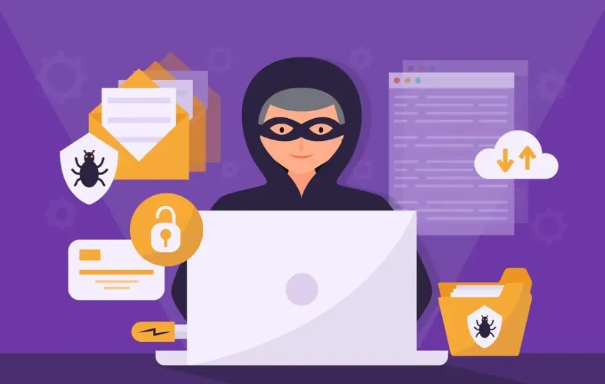 Masked figure in a hoodie at a laptop surrounded by email, credit card and malware icons